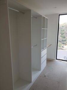 Standard-White-Board-Shelving-with-Chrome-Hanging-Rods-Bank-of-Drawers