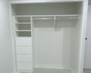 WhiteBoardBuilt-InShelvingwithaBankofDrawersandHangingRails-DarranHeppleston