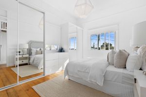 MirrorRobeDoorswithWhiteFrameBanksofDrawerswithFramelessMirror
